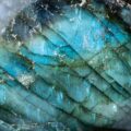 Macro photo of a colorful and illuminated labradorite stone with iridescent textures and luminous colors