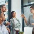 A group of colleagues having a discussion in a modern office