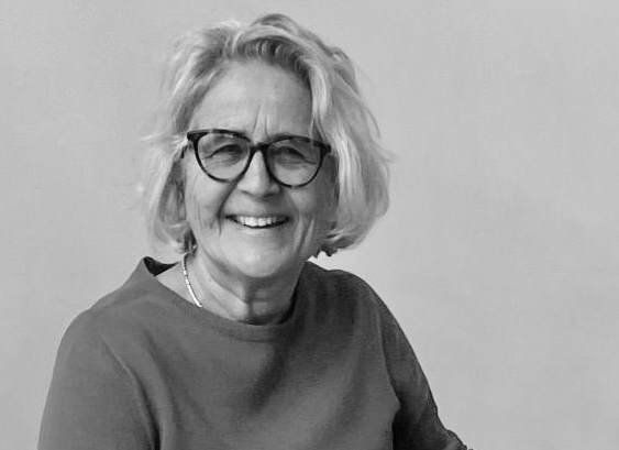 Francesca Cardona smiling woman wearing glasses black and white photo