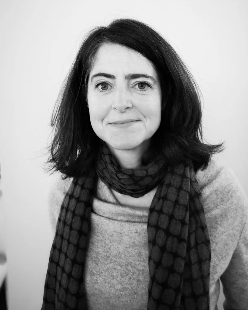 Gwen Hanrahan woman smiling medium length dark hair black and white photo